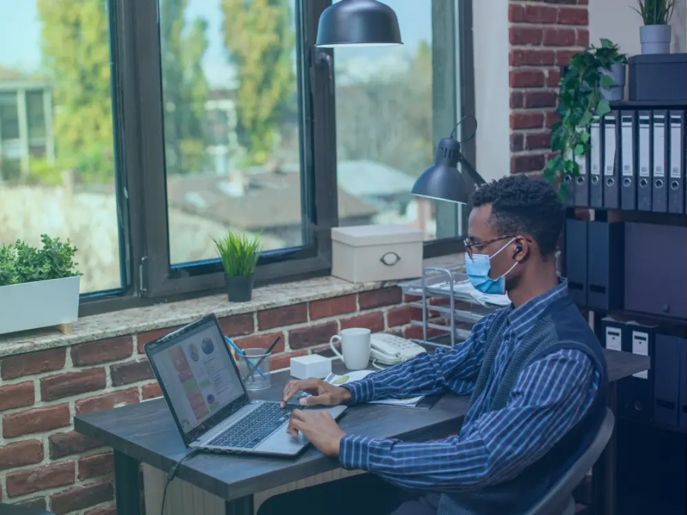 Service professional setting up office equipment in a home office